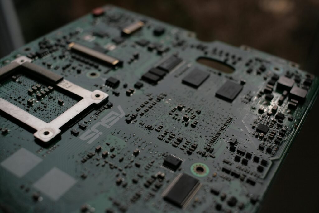 Detailed view of a computer motherboard showcasing intricate electronic components.
